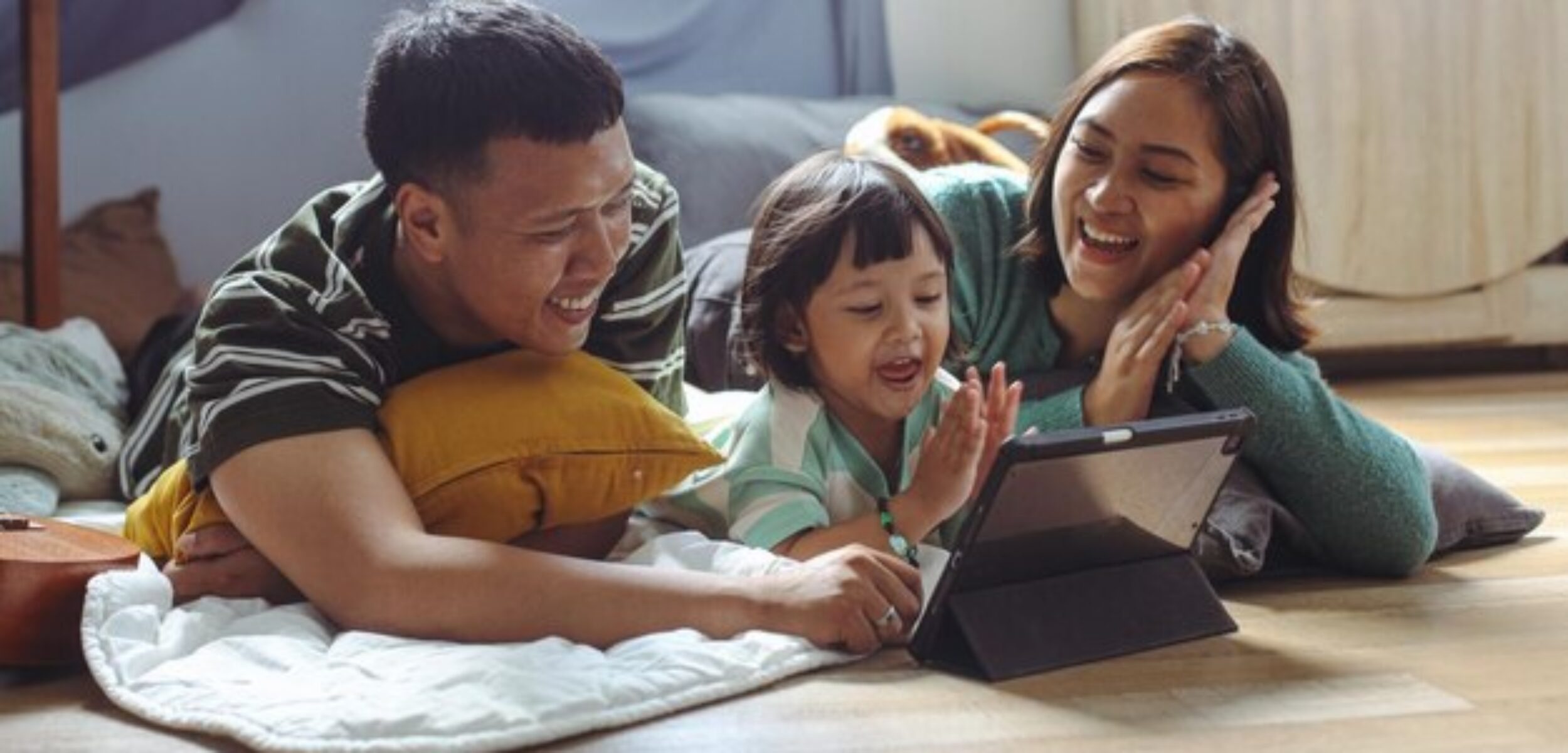 happy asian family little daughter are lying floor home watching tablet together 368093 13220